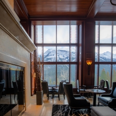 A sitting area with big black chairs