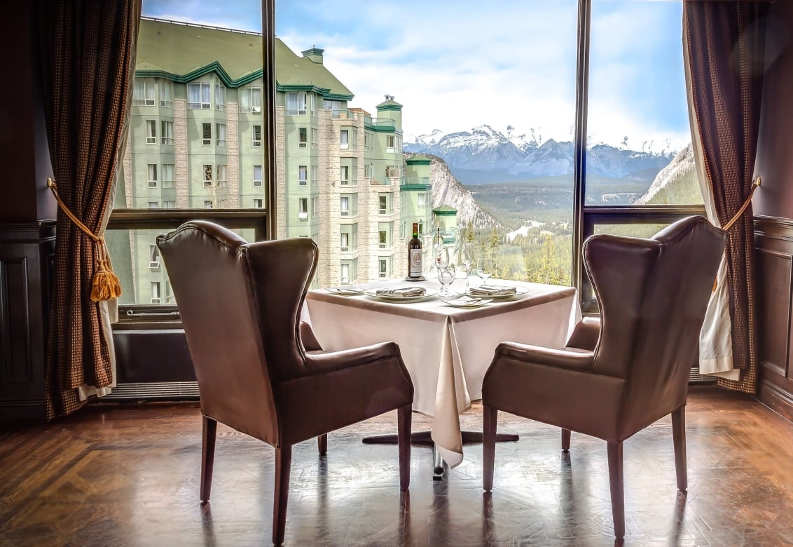 Two chairs facing a view of a mountain