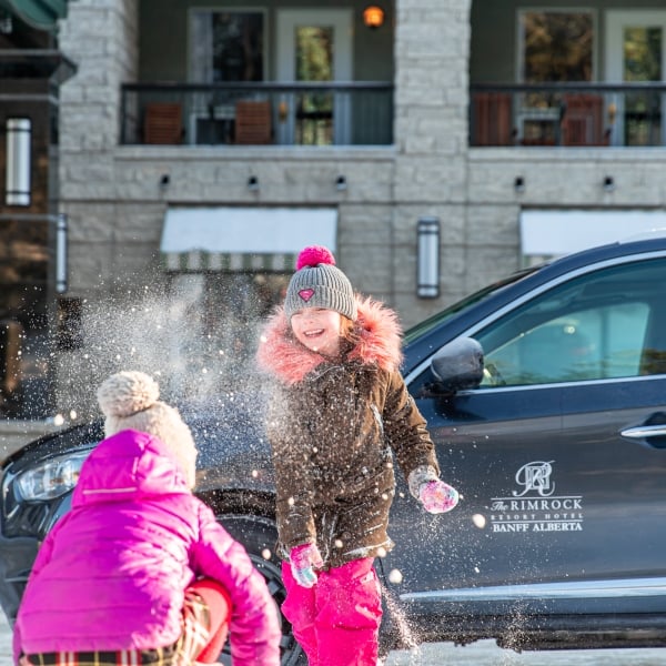 Two children playing in the snow