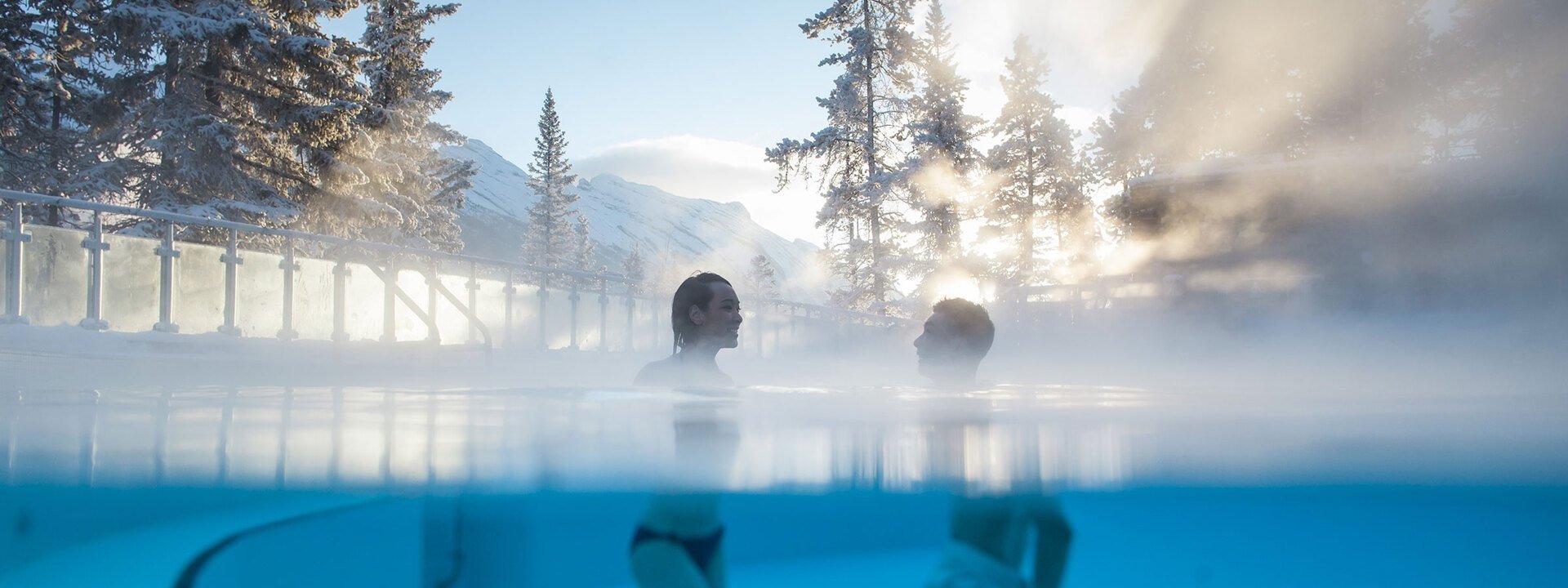 Two people enjoying the hot springs in Banff