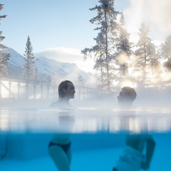 Two people enjoying the hot springs in Banff