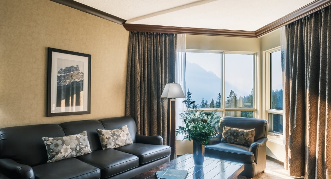 couch and coffee table in hotel room