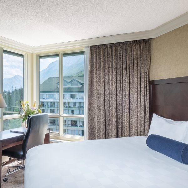 Bed with view of Rimrock Resort hotel