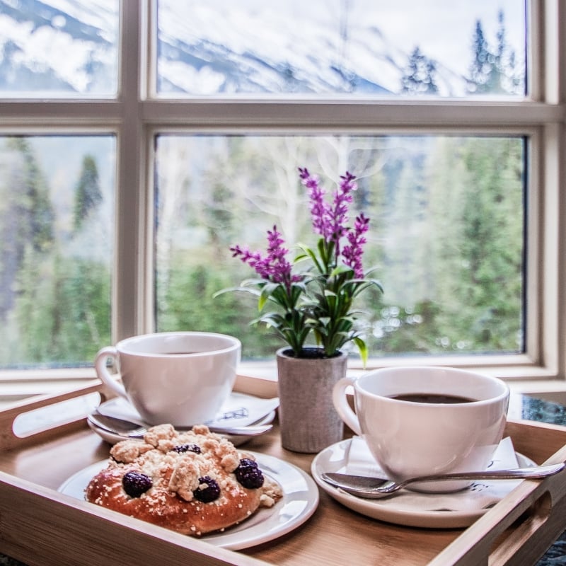 A breakfast tray with flowers on it