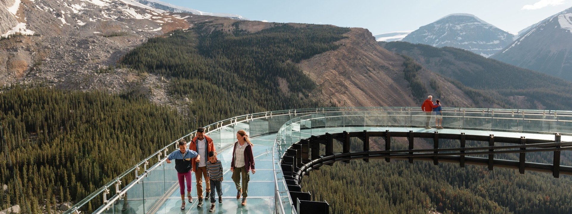 A family walking on the Banff skywalk