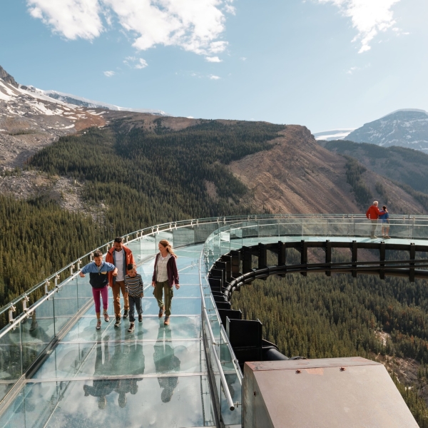 A family walking on the Banff skywalk