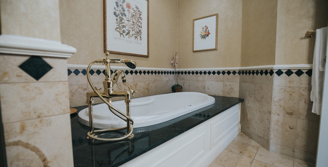 Bathtub with gold faucets