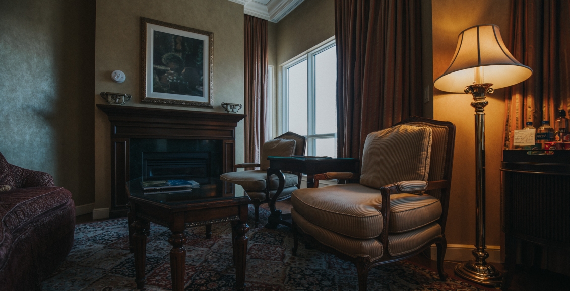 Living room with chair and fireplace