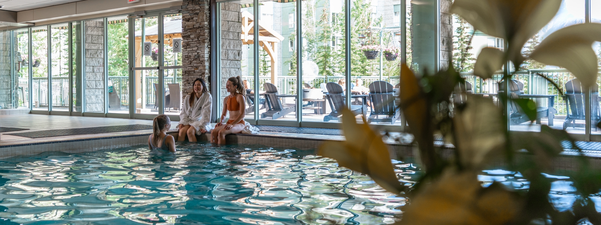 Girls sitting poolside at The Rimrock Resort Hotel