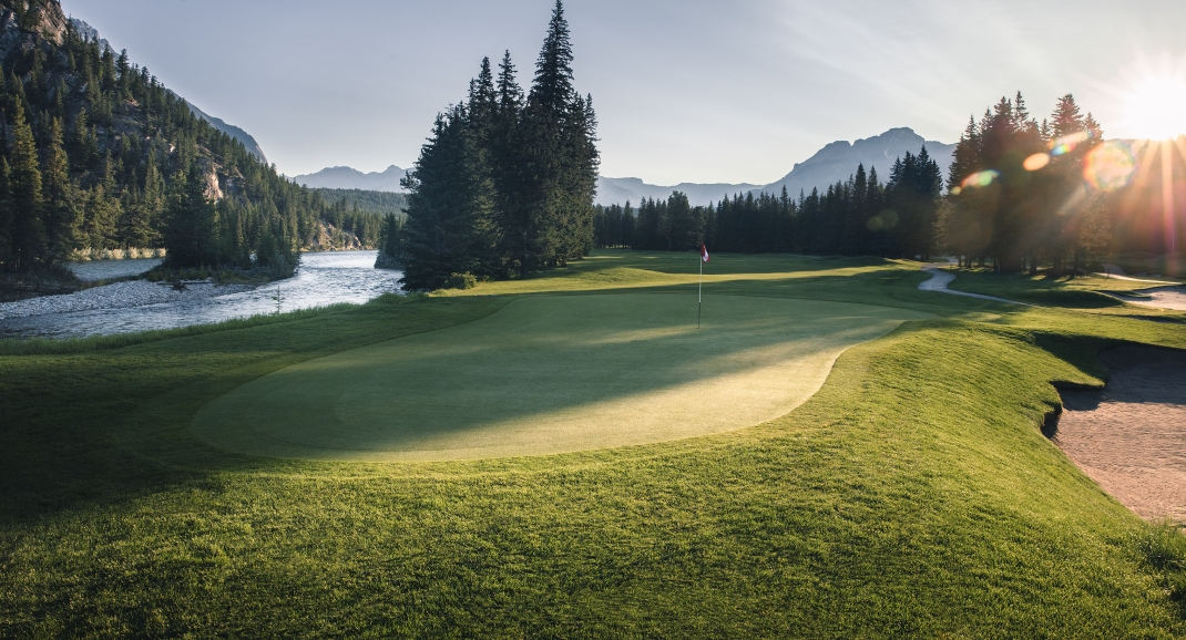 Sun peaks through on the golf green in Banff National Park