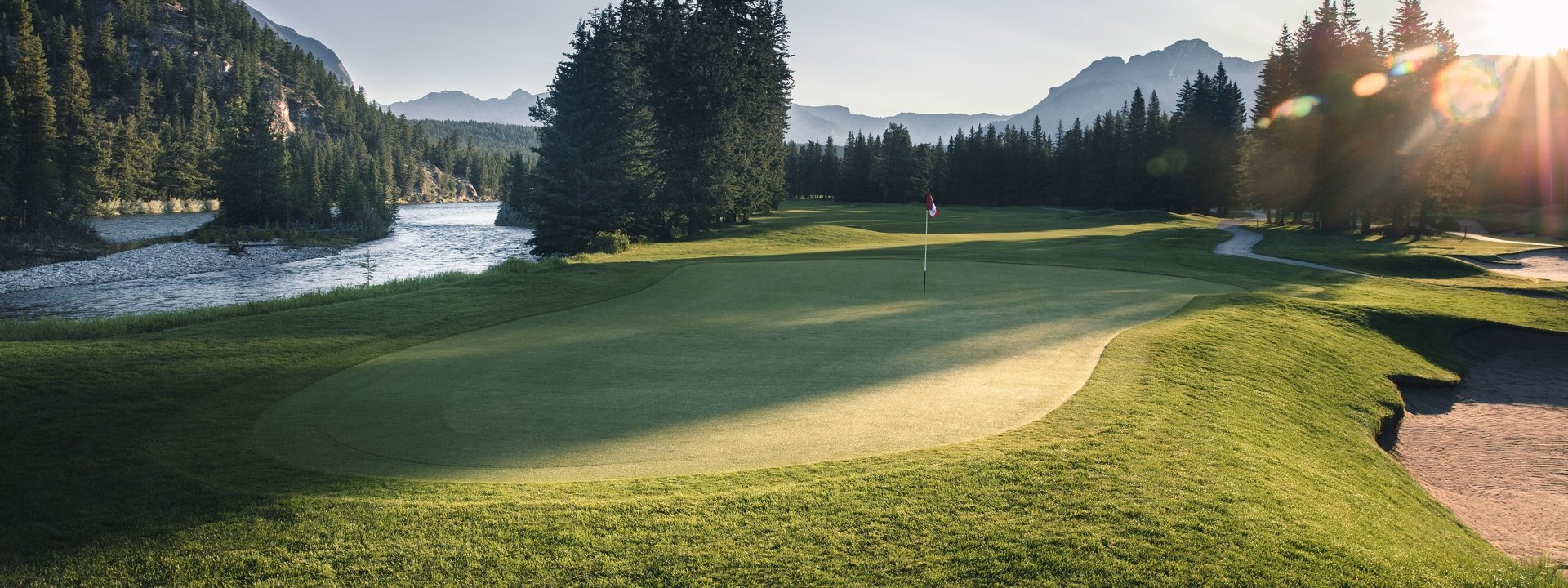 Sun peaks through on the golf green in Banff National Park