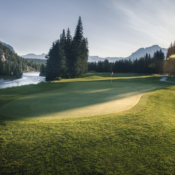 Sun peaks through on the golf green in Banff National Park