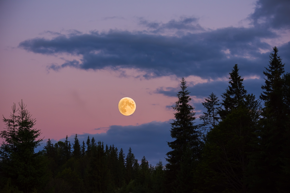 full moon over mountains
