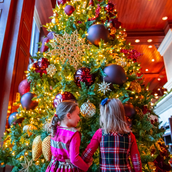 little girls at a Christmas tree