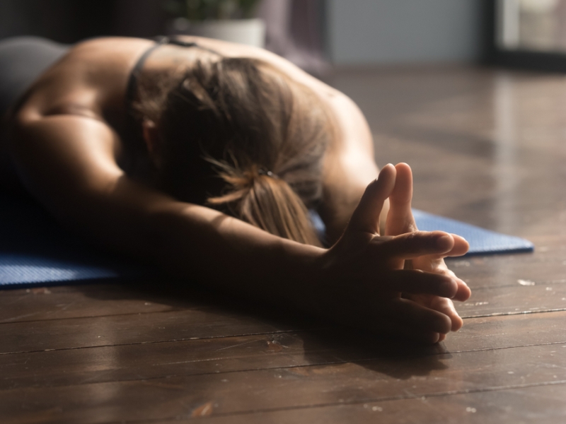 woman stretching on floor