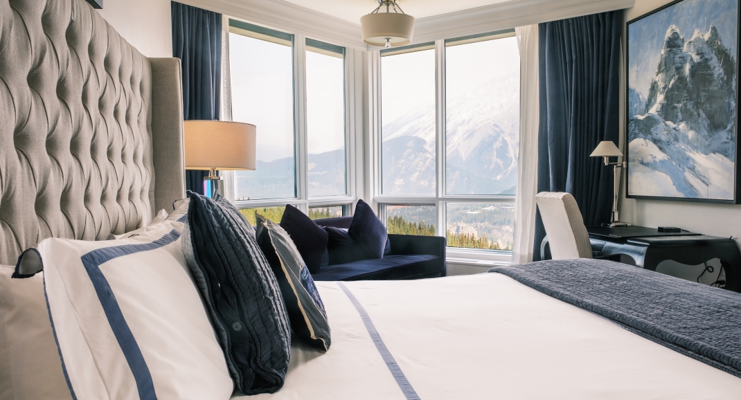 View of the mountains in Banff from the beds at The Rimrock Resort Hotel