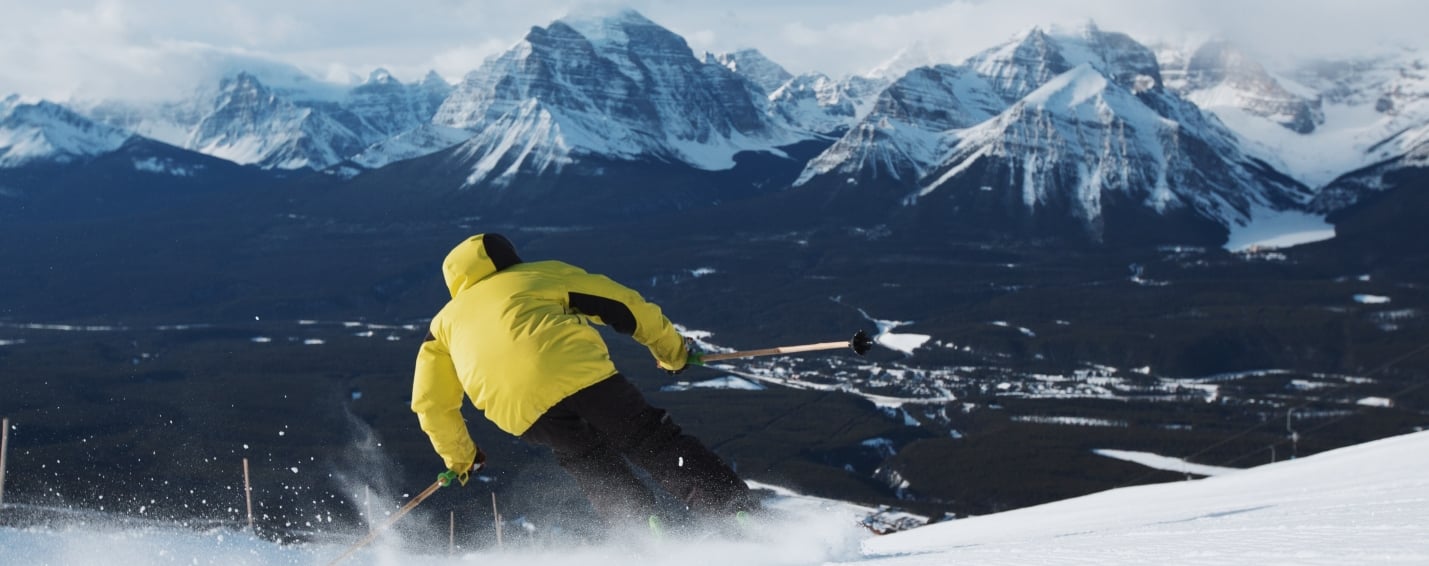 Lake Louise Skier heading down a mountain in Banff National Park
