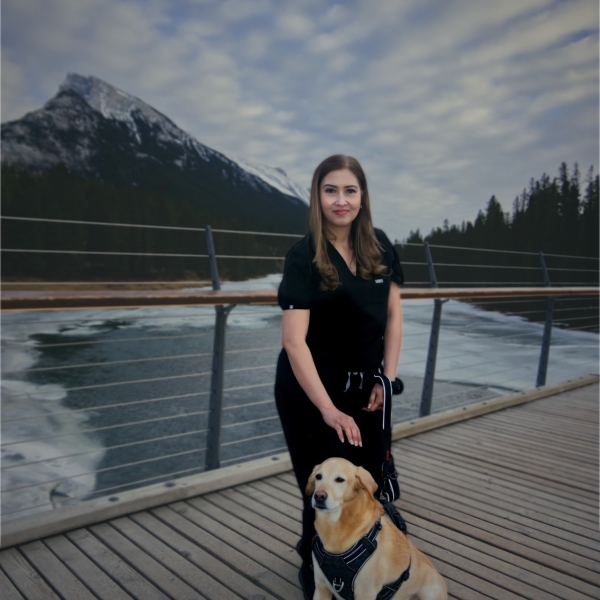 woman with her dog on bridge in from of rundle