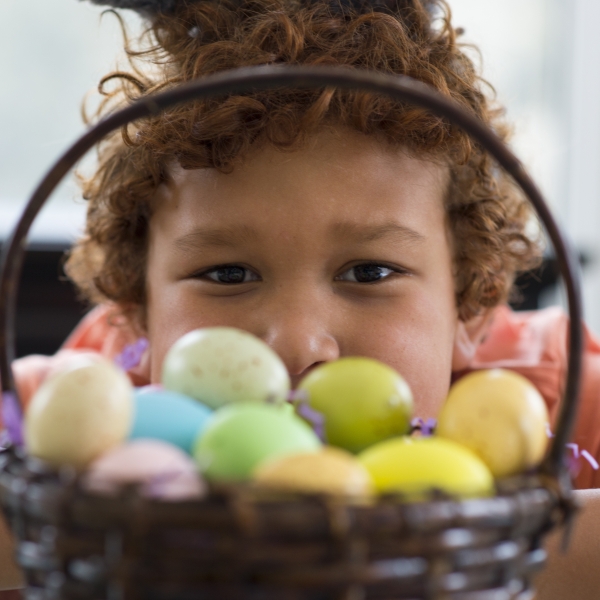 Child with basket of eggs from Easter Egg Hunt