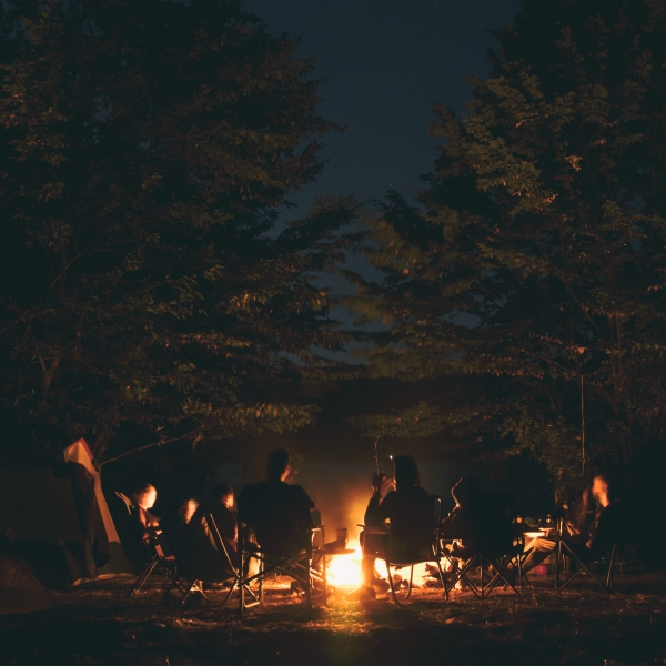 people gathered around a fire