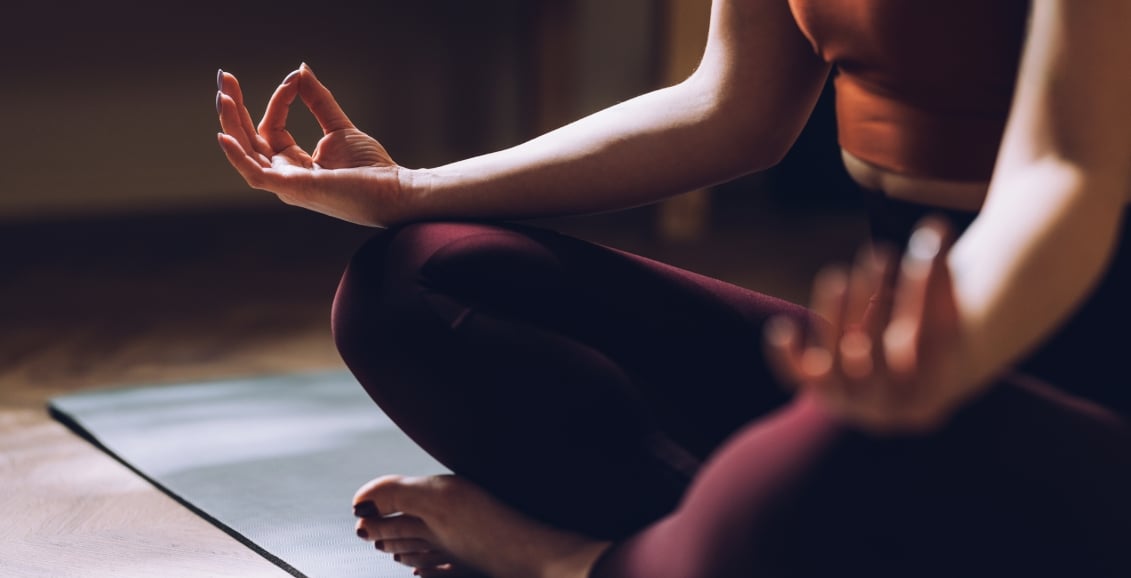 Woman doing yoga on the floor