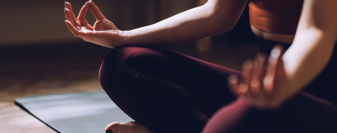 Woman doing yoga on the floor