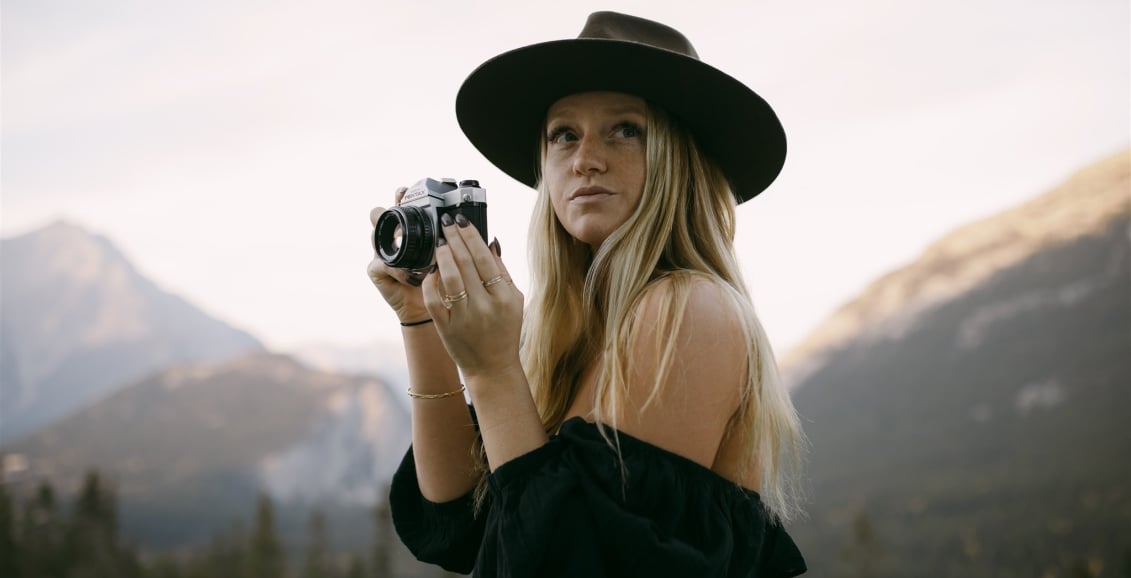 Woman at the Rimrock with a camera
