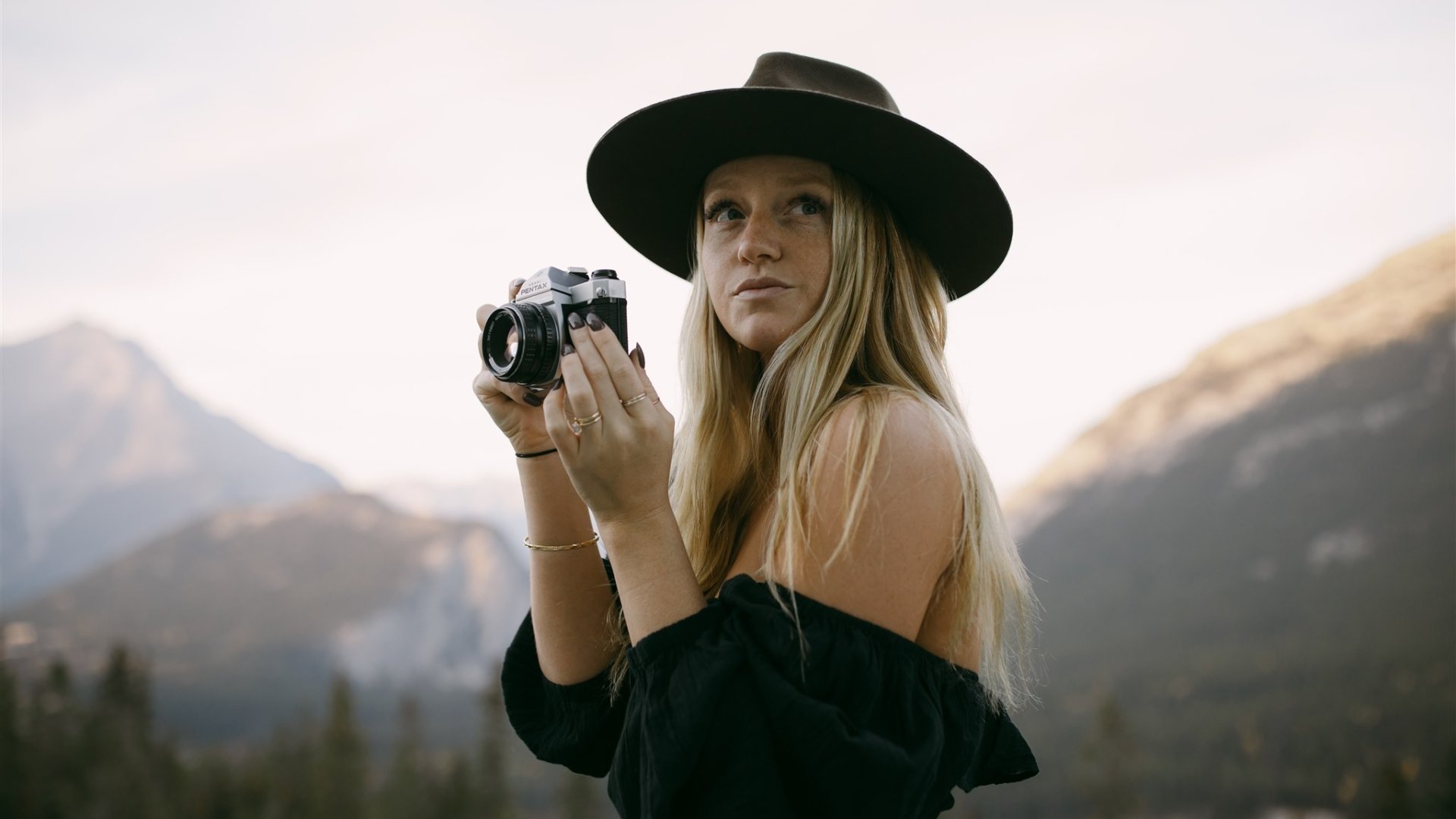Woman at the Rimrock with a camera