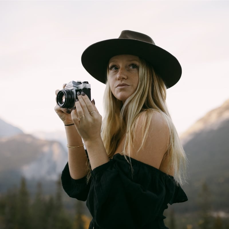 Woman at the Rimrock with a camera