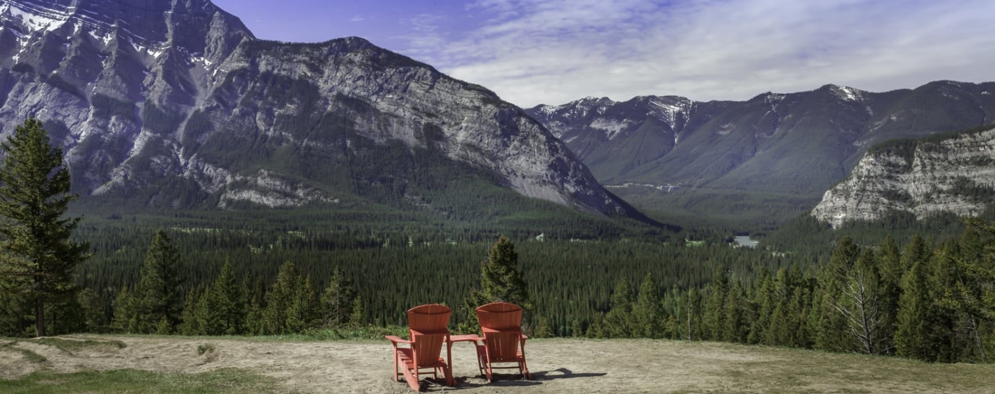Two Red Chairs looking at Rundle Mountain