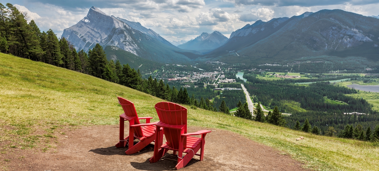 Two red chairs on overlooking banff