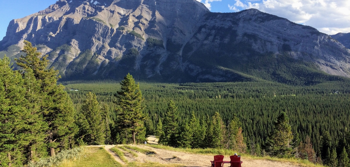 Two red chairs at the hoodoos in Banff