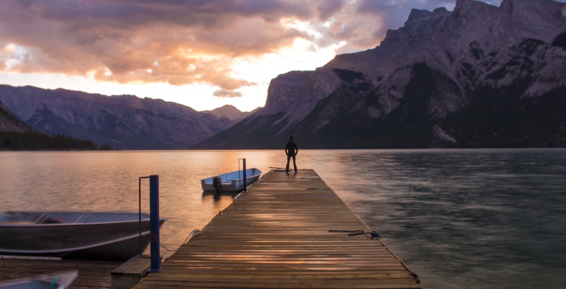 Man standing at Lake Minnewanka in Banff National Park