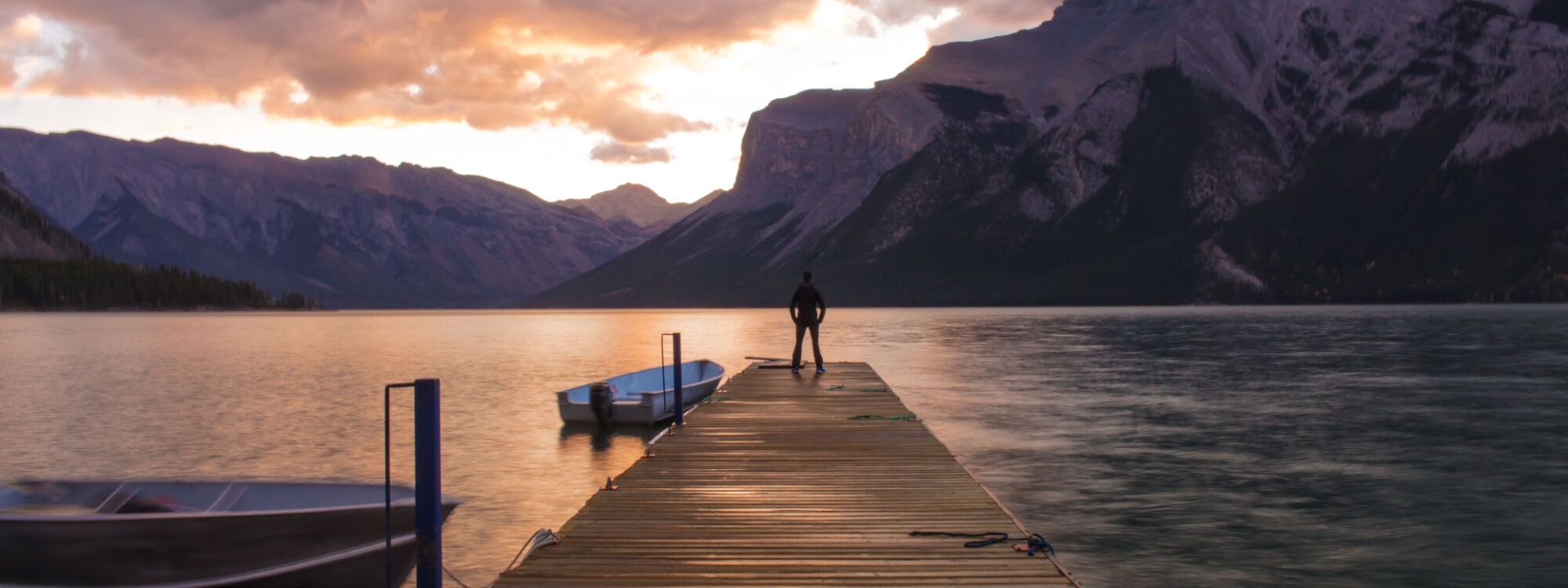 Man standing at Lake Minnewanka in Banff National Park