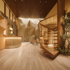 Juice bar at Rimrock Banff, Bathhouse with a climbing wall in the background.