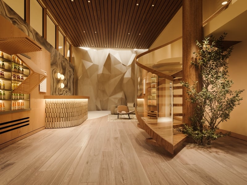 Juice bar at Rimrock Banff, Bathhouse with a climbing wall in the background.