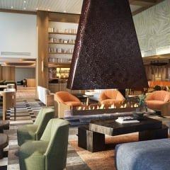 The lobby bar Social at Rimrock Banff, Emblems. The soft comfy chairs and huge central fireplace