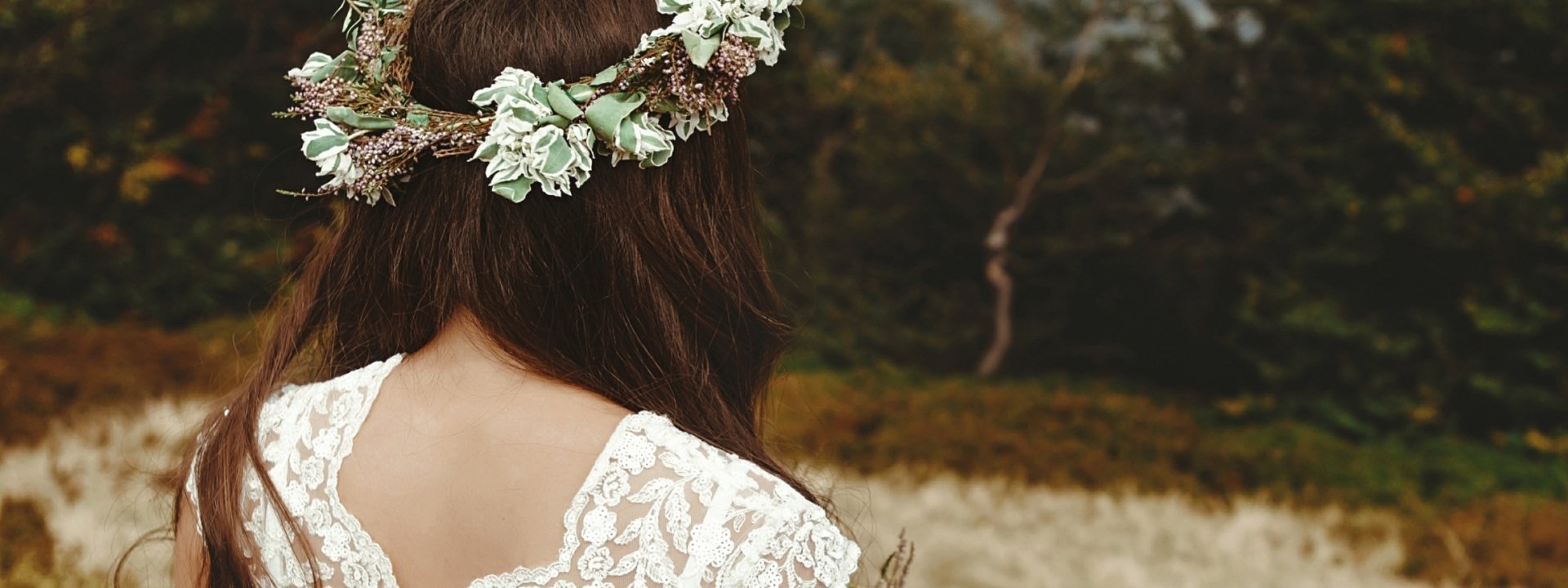 a bride looking away from the camera into the mountains in the distance.